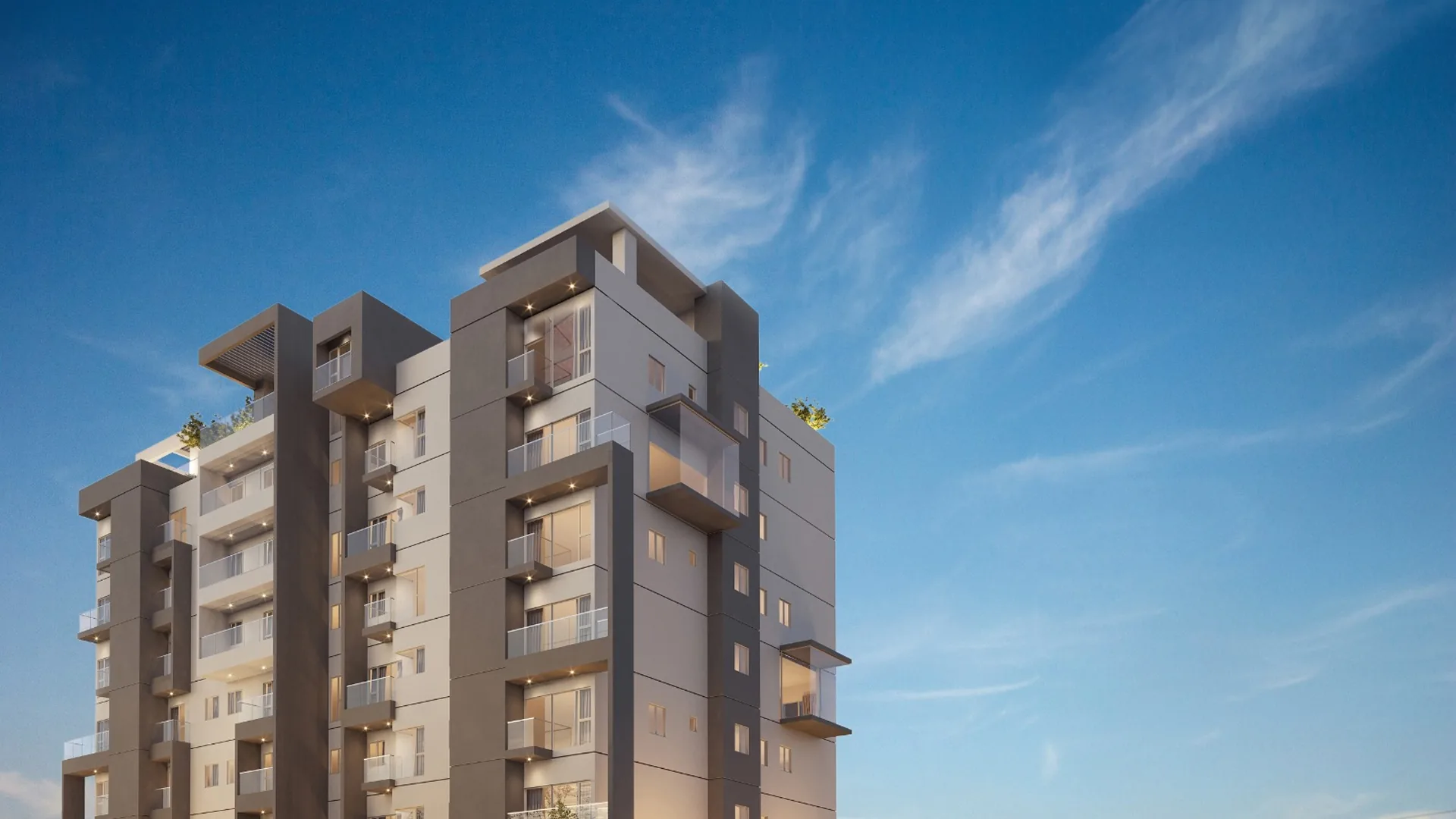 Torre residencial moderna de Nuvo Naranjo bajo un cielo azul